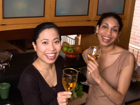 Two women at a home bar